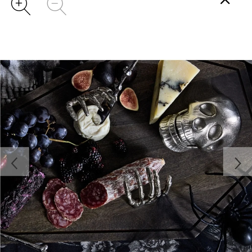 Skeleton on Dark Brown Coffin charcuterie board by Pottery Barn